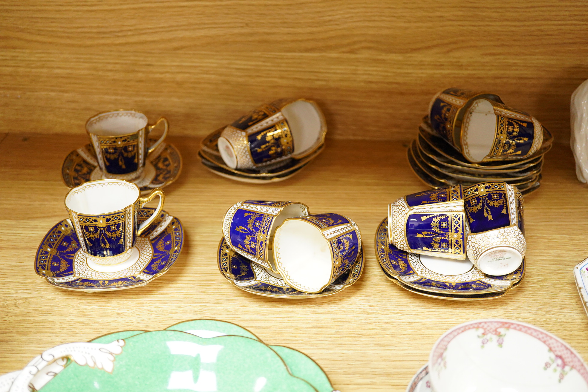 A collection of Coalport porcelain to include cups and saucers, a Meissen Pony, Meissen blue and white plate and a 19th century desk stand, largest 25cm wide
